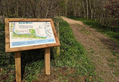 An image of a Green Way lectern interpretation board installed by the side of a footpath