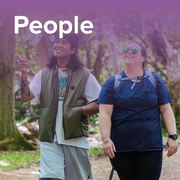 3 people enjoying a walk in a forest